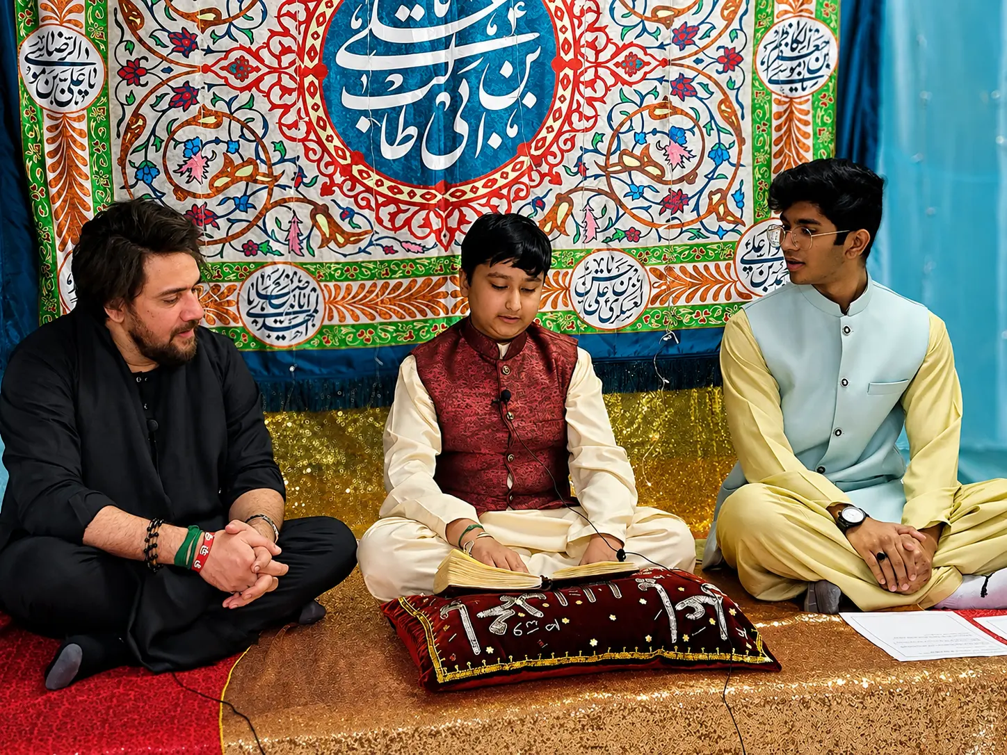 A student reciting with the teacher.